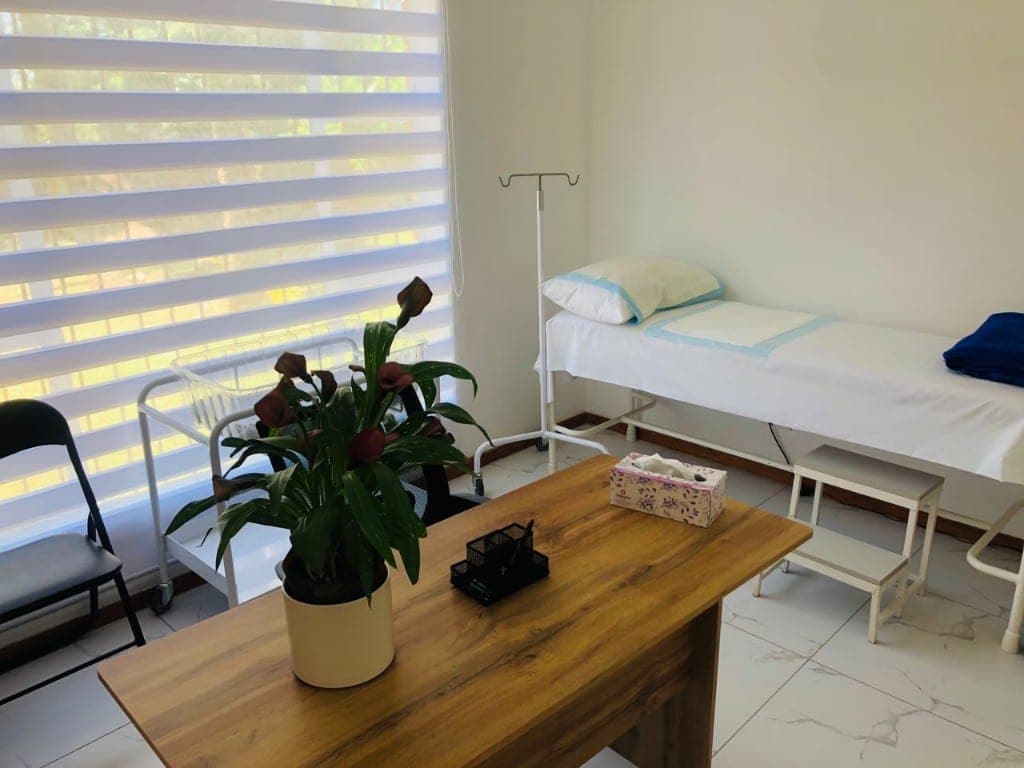 Prepared consultation and examination room at Elshaddai Health Care Centre
